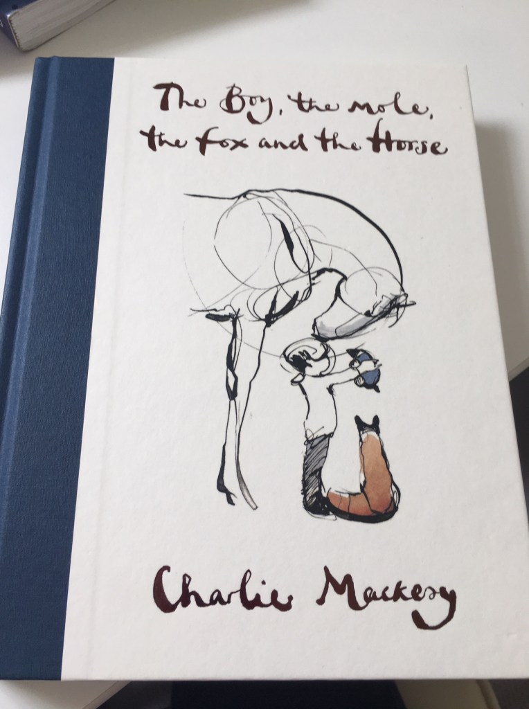 This is a photo of the cover of The boy, the mole, the fox and the horse, written by Charlie Mackesy. 
